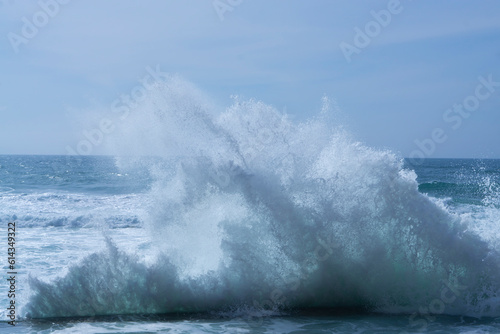Waves in the ocean. Portugal coast ocean waves. Beautiful colour. Beautiful sea waves with foam of blue and turquoise color isolated on white background.