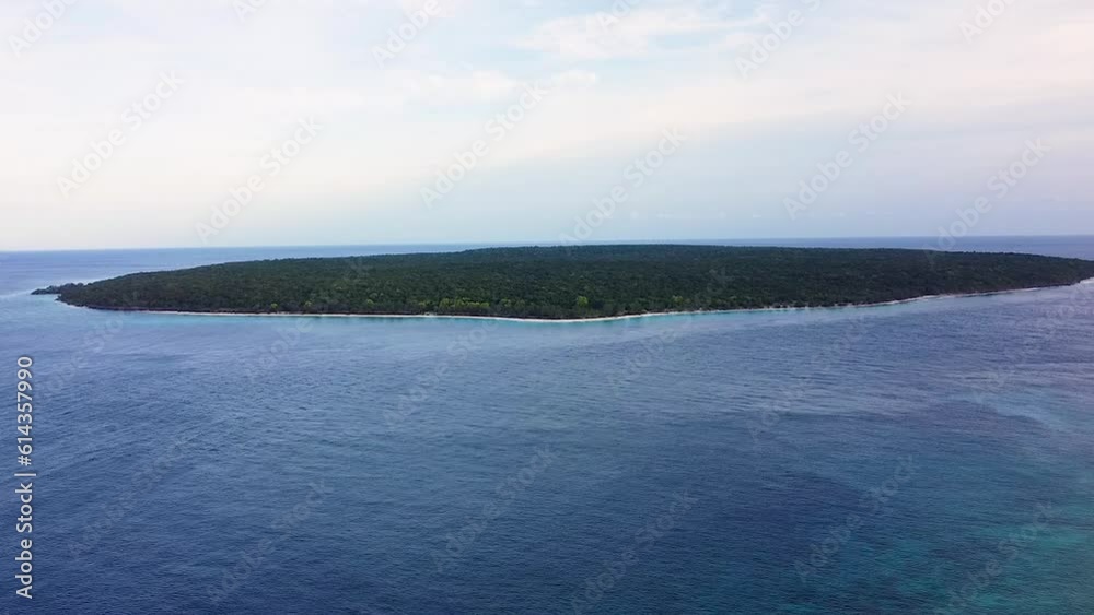 Aerial view of Jaco Island in Timor-Leste, remote and uninhabited tropical island in Indo-Pacific ocean of Southeast Asia Aerial view of Jaco Island in Timor-Leste, remote and uninhabited tropical island in Indo-Pacific ocean of Southeast Asia