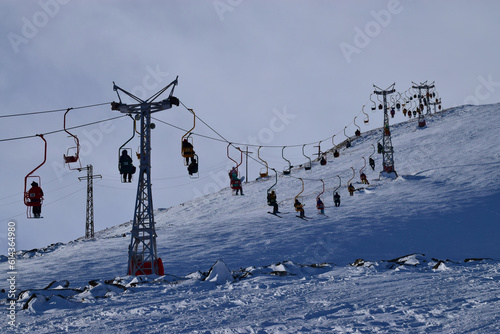 View of the cable car with skiers on Cheget