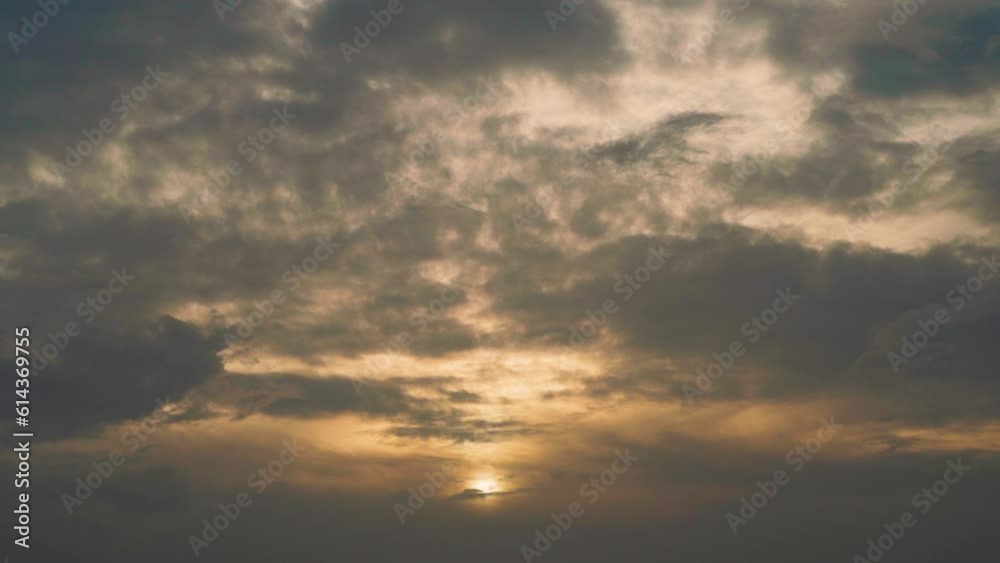 4K shot of clouds above the rising sun during cloudy day at India. Orange clouds during the sunrise. Motivational background with copy space. Sunrise depicting new hope for new beginnings concept. 4K shot of clouds above the rising sun during cloudy day at India. Orange clouds during the sunrise. Motivational background with copy space. Sunrise depicting new hope for new beginnings concept.
