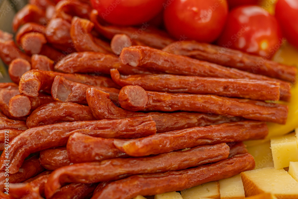 Cured meat with toppings. Homemade salami, chorizo and other cured sausages. Dried sausages cut into thin slices Cured meat with toppings. Homemade salami, chorizo and other cured sausages. Dried sausages cut into thin slices