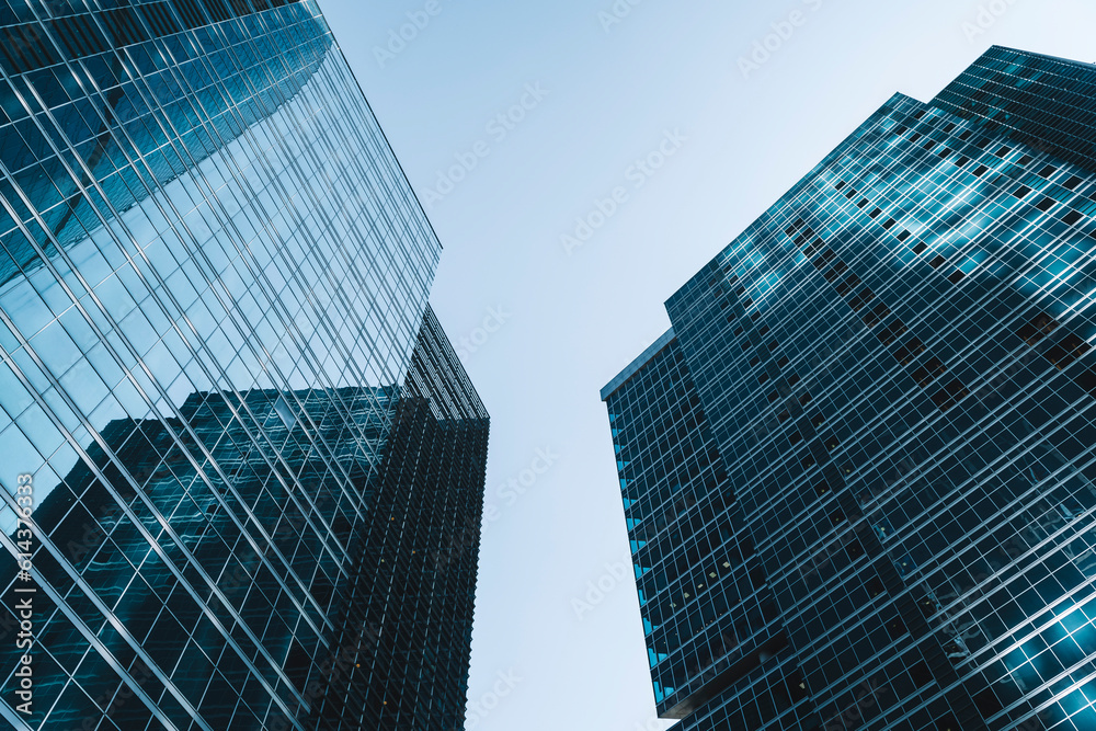 Obraz premium Business skyscrapers and office business center building architecture in perspective on blue sky. Economy, exchange, finance concept.