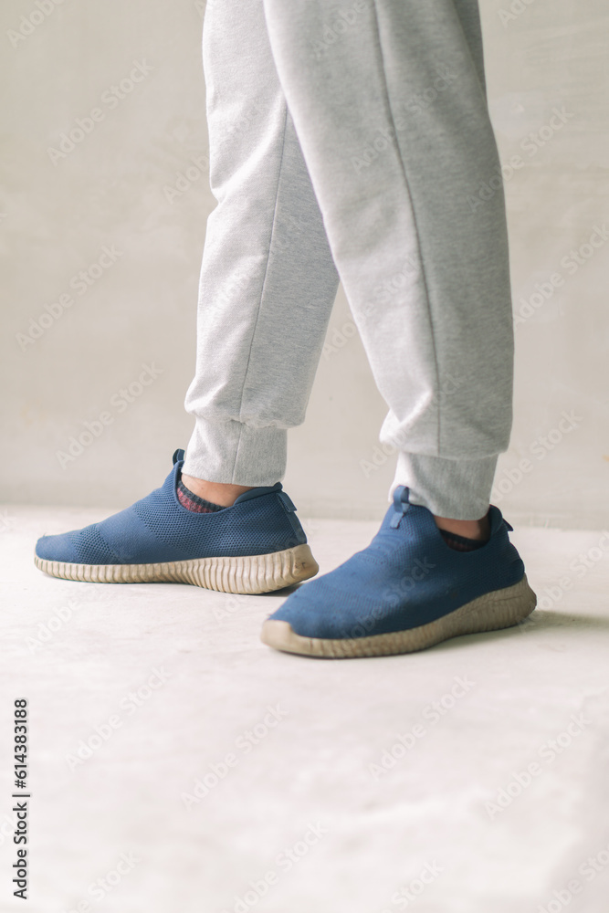 Person standing in spring footwear, focusing on low limb & shoe. Person standing in spring footwear, focusing on low limb & shoe.
