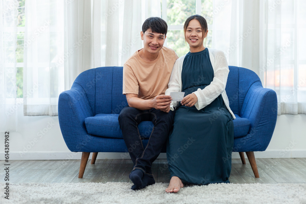 man and pregnant woman looking at baby ultrasound pad with her lover happy pregnant woman looking at ultrasound film. man and pregnant woman looking at baby ultrasound pad with her lover happy pregnant woman looking at ultrasound film.