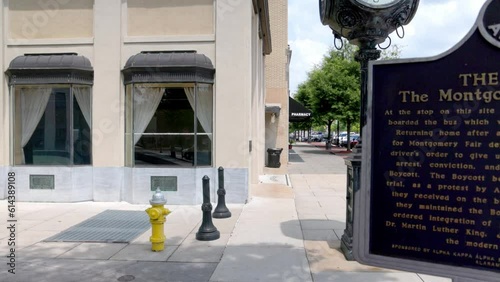 Rosa Parks Bus Stop location historical marker in downtown Montgomery, Alabama with video panning left to right. photo