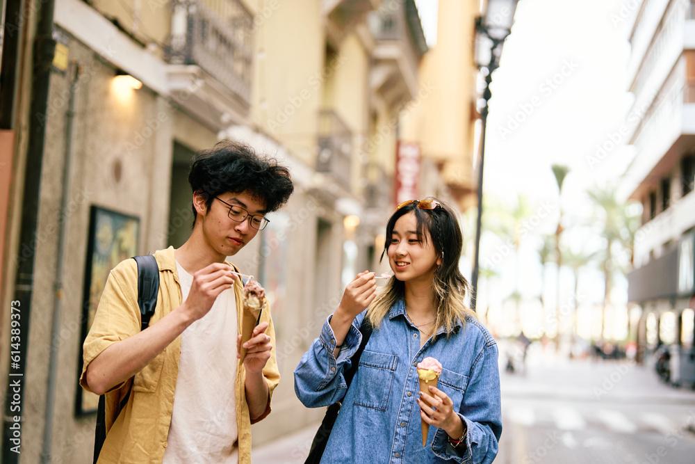 city young woman travel tourist outdoor couple happy vacation lifestyle holiday street summer urban tourism traveler town journey trip ice cream dessert food