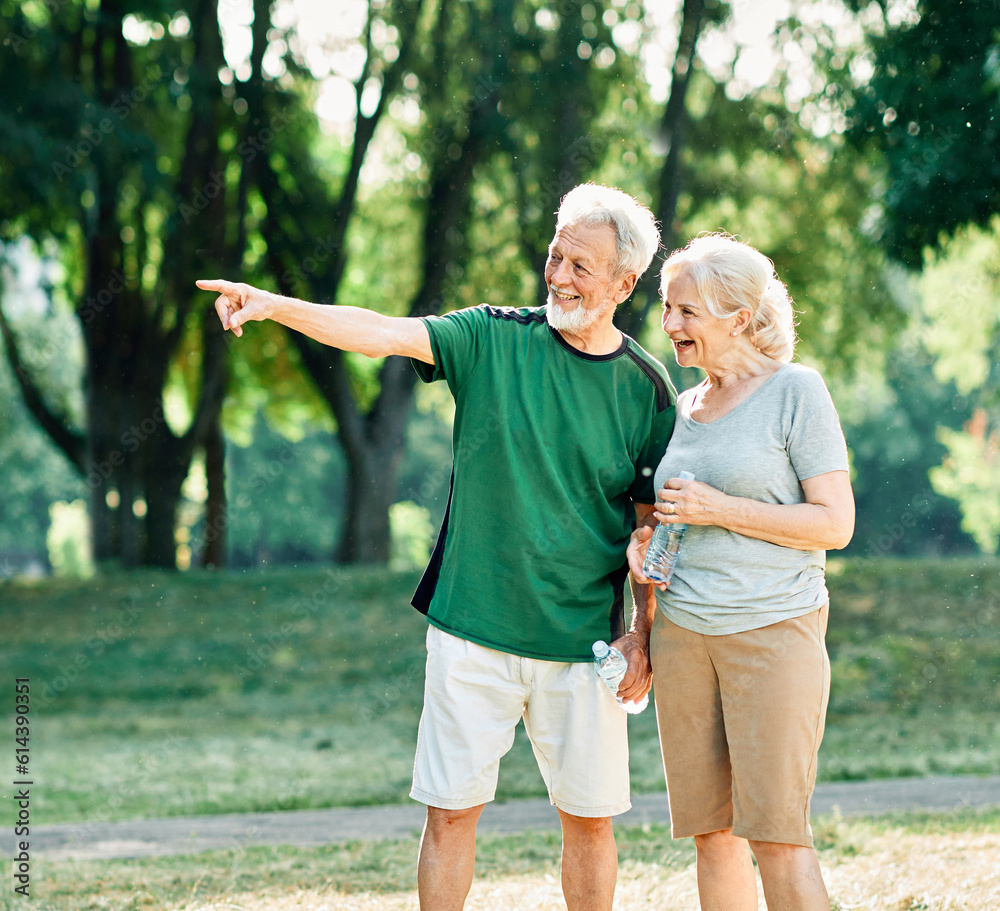 Fototapeta premium woman senior man outdoor running couple lifestyle sport smiling together jogging healthy nature fit happy active retirement exercise fitness run