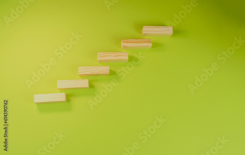 wooden steps made of planks on a light green background