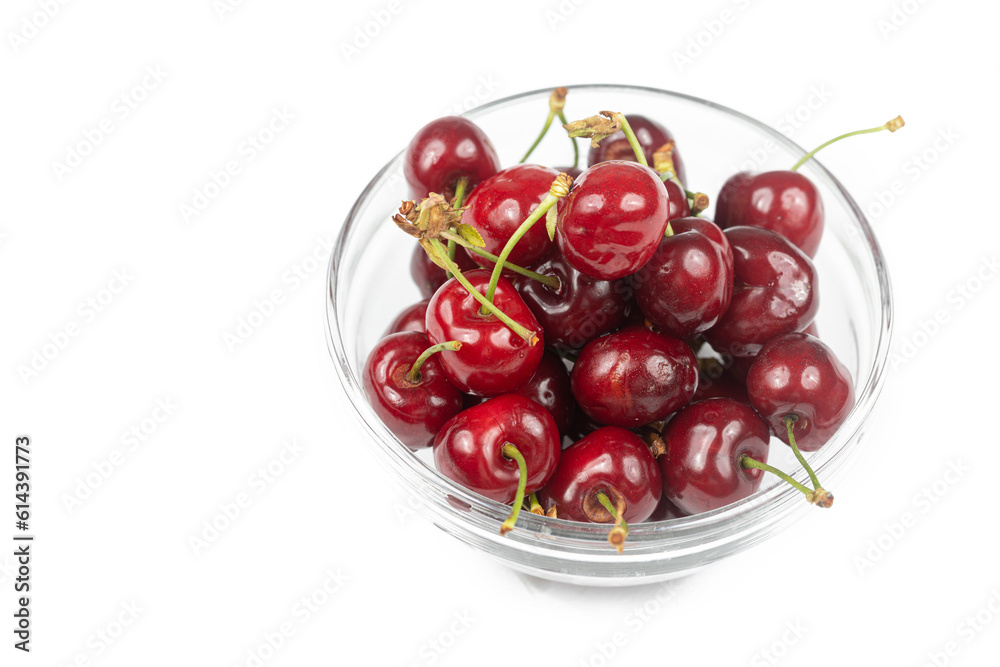 Cherries in the bowl isolated above white background with copy space Cherries in the bowl isolated above white background with copy space