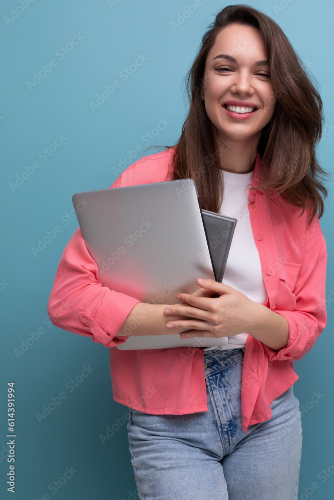 smart student brunette young woman in shirt and jeans with laptop smart student brunette young woman in shirt and jeans with laptop