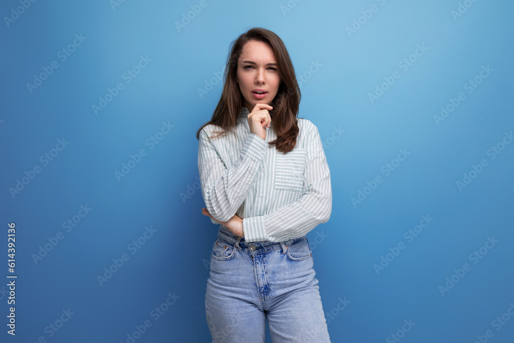 pretty young brunette woman in shirt on studio background pretty young brunette woman in shirt on studio background