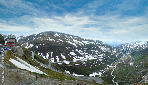 Summer cloudy mountain landscape with road  Furka Pass  Switzerland . Panorama.