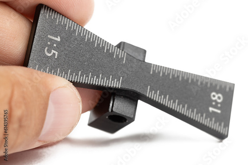 Vászonkép Metal dovetail jig template isolated above white background with copy space