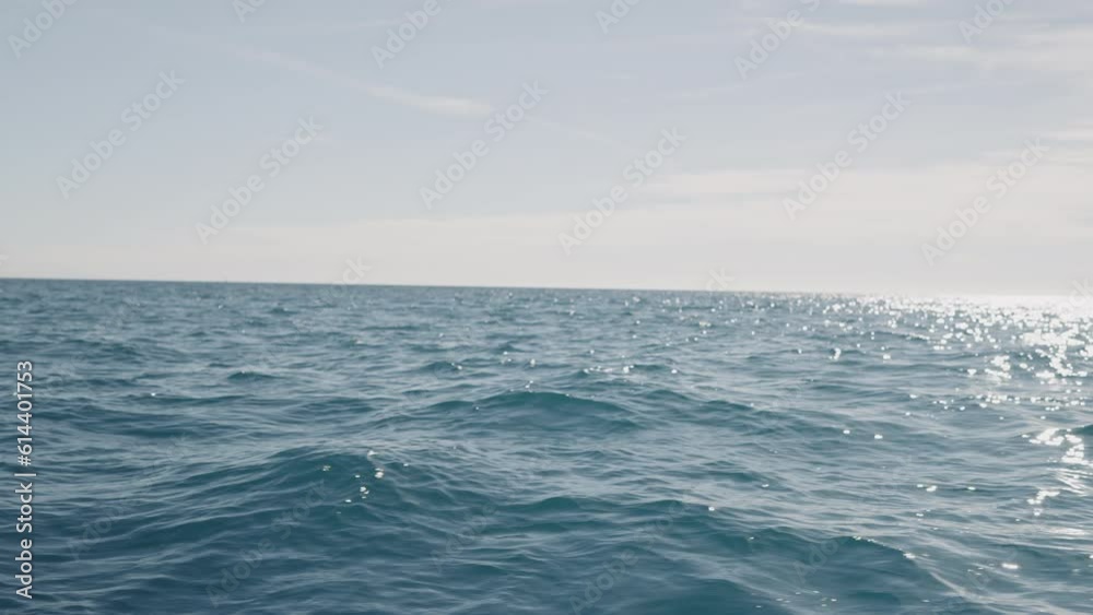 Slow motion side view of sea surface from a boat Slow motion side view of sea surface from a boat