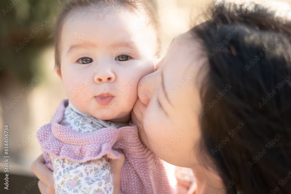 pure joy as a young Asian Chinese mother lovingly plays with her little baby girl, creating a lasting affection happiness bond - motherhood beauty and childhood innocence pure joy as a young Asian Chinese mother lovingly plays with her little baby girl, creating a lasting affection happiness bond - motherhood beauty and childhood innocence