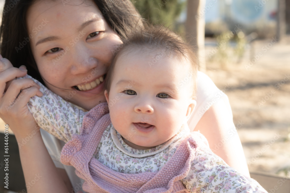 pure joy as a young Asian Chinese mother lovingly plays with her little baby girl, creating a lasting affection happiness bond - motherhood beauty and childhood innocence pure joy as a young Asian Chinese mother lovingly plays with her little baby girl, creating a lasting affection happiness bond - motherhood beauty and childhood innocence