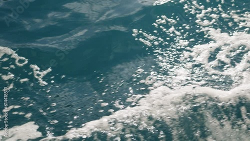 Slow motion of boat trail on a sea surface photo