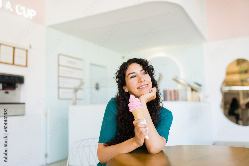 Happy beautiful woman enjoying coming to the ice cream shop Happy beautiful woman enjoying coming to the ice cream shop