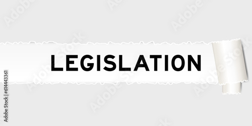 Ripped gray paper background that have word legislation under torn part