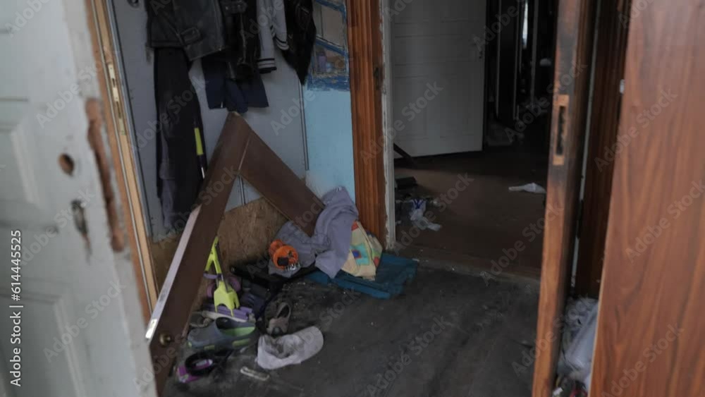 Broken furniture, a house destroyed by bombing in Ukraine, with belongings scattered about. Broken furniture, a house destroyed by bombing in Ukraine, with belongings scattered about.