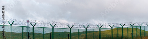  a barbed wire that keeps people from approaching. barbed wire along China's border. barbed-wire fence,