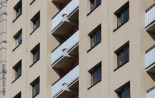 Windows and balconies of a residential building. Urban background.