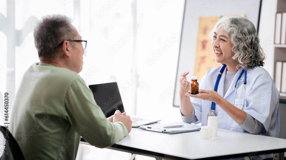 Female doctor showing bottle of pills to explaining medicine use