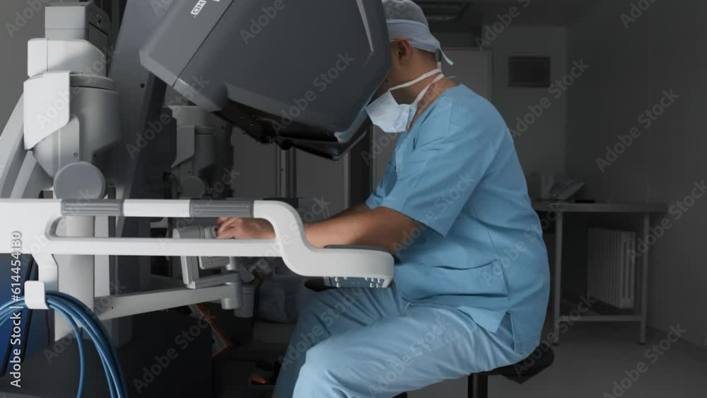 Workplace of surgeon using modern minimal invasive robotic medical system. Doctor watches