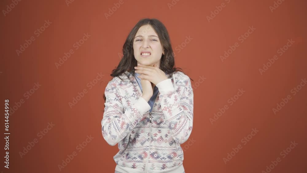 Young woman with sore throat.