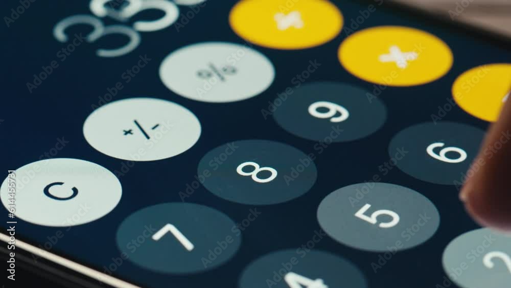 Man counts numbers on a calculator phone screen , smartphone, cell phone. Arithmetic, accounting, payroll, money. Add, subtract, multiply, divide. High quality studio shot close up, macro. Man counts numbers on a calculator phone screen , smartphone, cell phone. Arithmetic, accounting, payroll, money. Add, subtract, multiply, divide. High quality studio shot close up, macro.