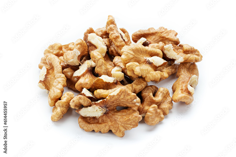 Closeup of big shelled walnuts pile on white background. Nuts are a source of vegetable protein. Closeup of big shelled walnuts pile on white background. Nuts are a source of vegetable protein.