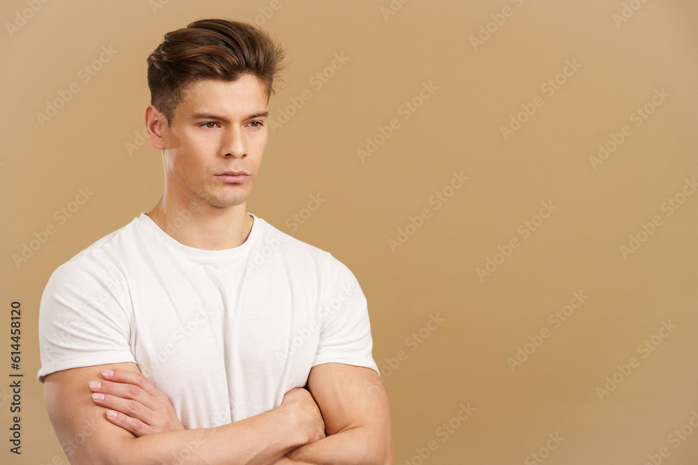 Handsome man crossing the arms with an angry expression Handsome man crossing the arms with an angry expression