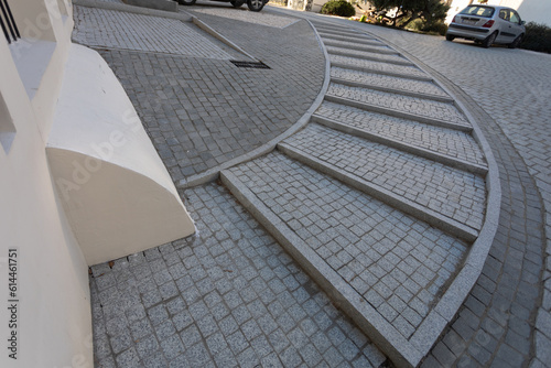 Semi-circular paving stone staircase seen from an upper perspective.