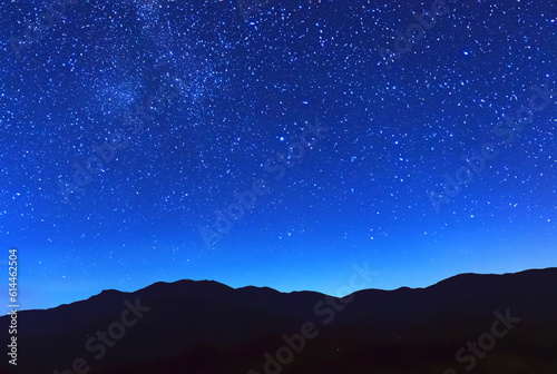 Colorful night sky landscape with starry sky. Mountain blue night sky with bright stars