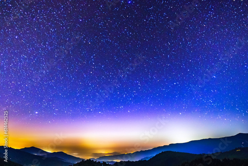 Colorful night sky landscape with starry sky. Mountain blue night sky with bright stars
