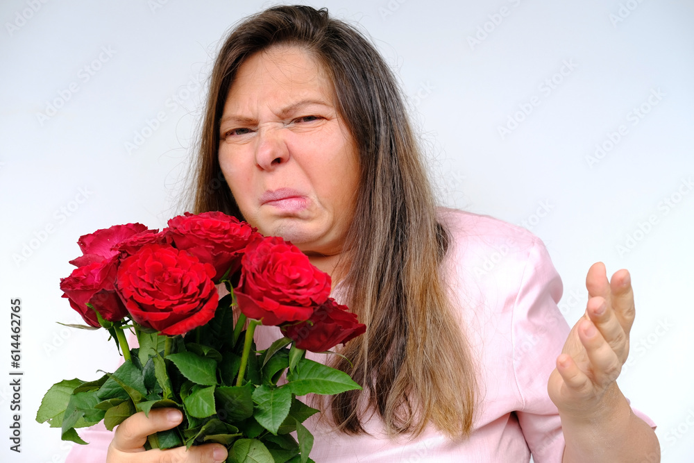 bouquet of flowers, red roses, middleaged woman 50 years old with