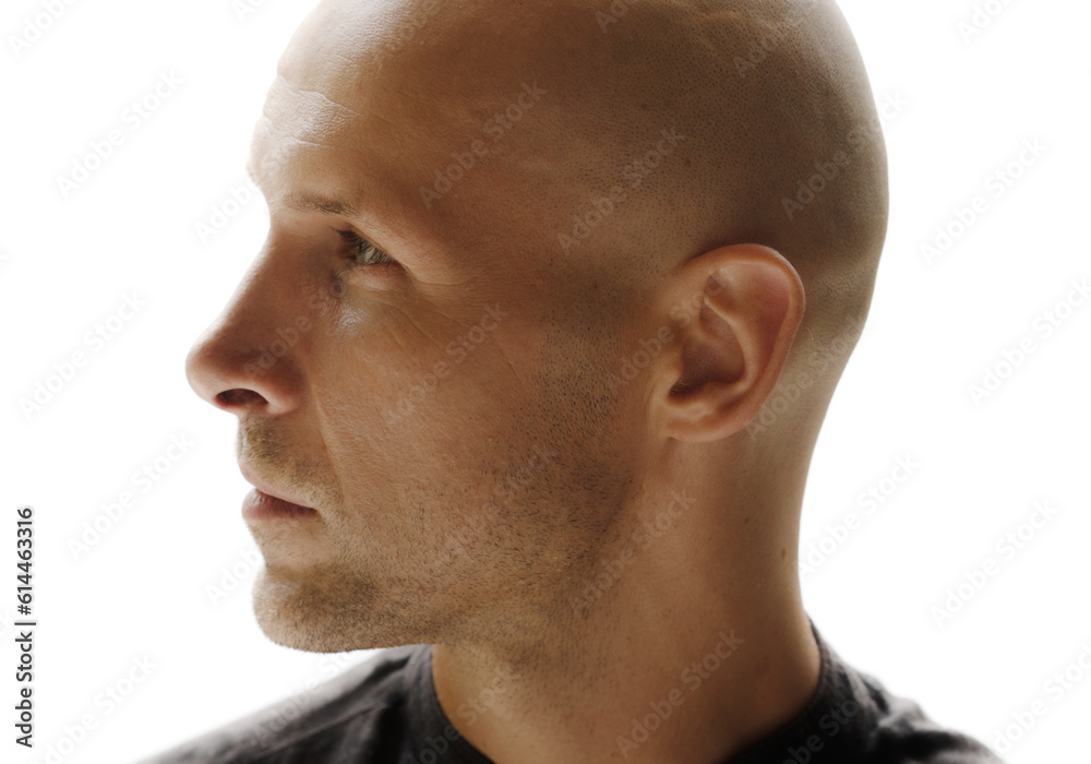 Fototapeta premium A closeup portrait of a bald man's profile looking to his right