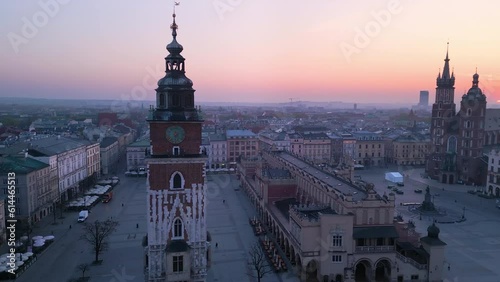 krakow city old town market square aerial view drone at sunrise dawn,flying around town hall tower photo