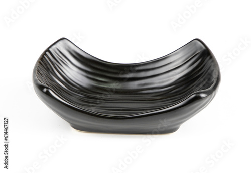 Black ceramic bowl isolated on white background.