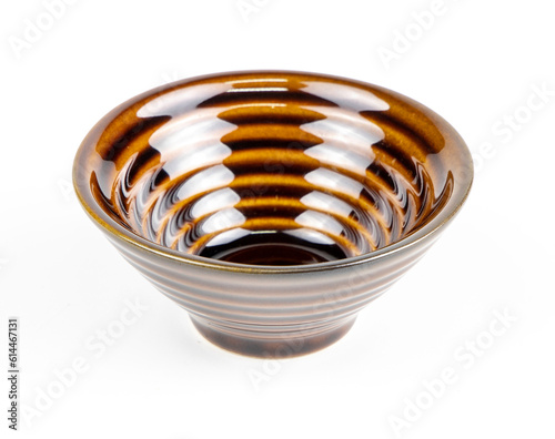 Black ceramic bowl isolated on white background.