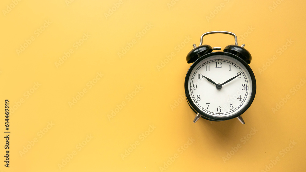 Concept of time, reminder, countdown, alert, deadline. Alarm clock isolated on yellow background.Copy space. Concept of time, reminder, countdown, alert, deadline. Alarm clock isolated on yellow background.Copy space.