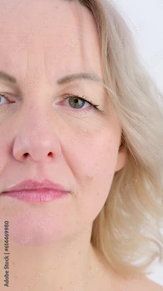 calm sad look of girl adult middle-aged woman on white background looks into frame, only eyes move, she froze Close up of Woman Face, Girl opening her Beautiful blue azzure Eyes, Attractive Ginger calm sad look of girl adult middle-aged woman on white background looks into frame, only eyes move, she froze Close up of Woman Face, Girl opening her Beautiful blue azzure Eyes, Attractive Ginger