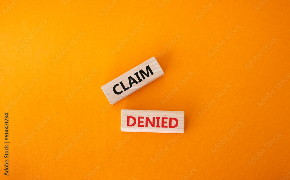 Claim denied symbol. Wooden blocks with words Claim denied. Beautiful orange background. Business and Claim denied concept. Copy space. Claim denied symbol. Wooden blocks with words Claim denied. Beautiful orange background. Business and Claim denied concept. Copy space.