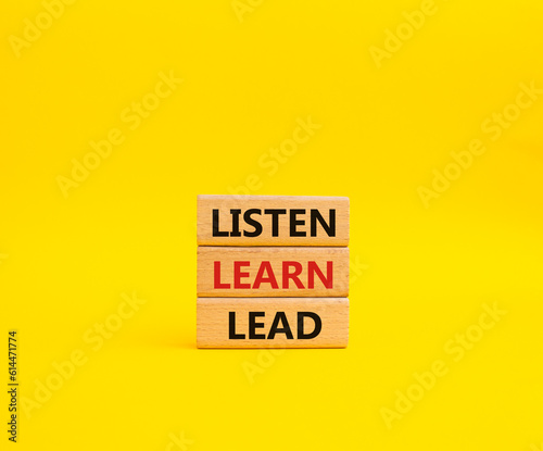 Listen Learn Lead symbol. Concept words Listen Learn Lead on wooden blocks. Beautiful yellow background. Business and Listen Learn Lead concept. Copy space.
