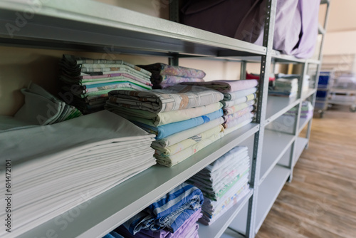 Sanitary prevention antivirus concept. Fresh White Hotel Towels Folded and Stacked on a Shelf