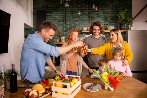Two families toasting with ...