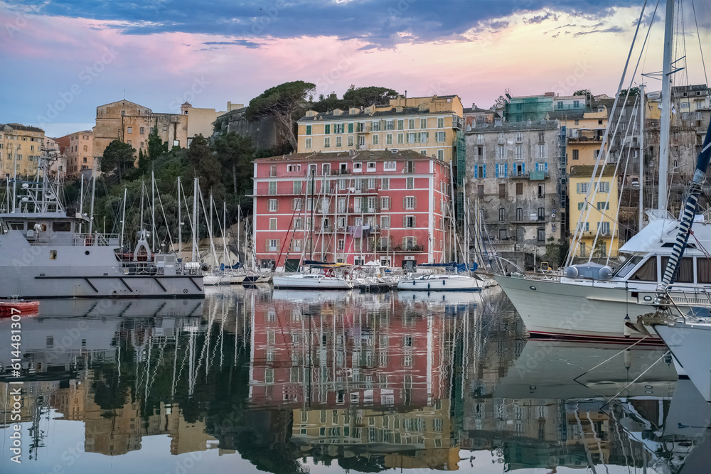 Corsica, Bastia, typical houses in the harbor in summer, sunset
