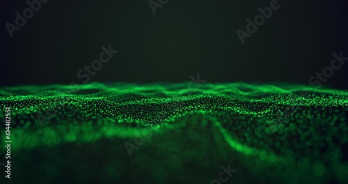 Abstract footage with wavy green particles. Depth of field effect, blur effect, loop possible.