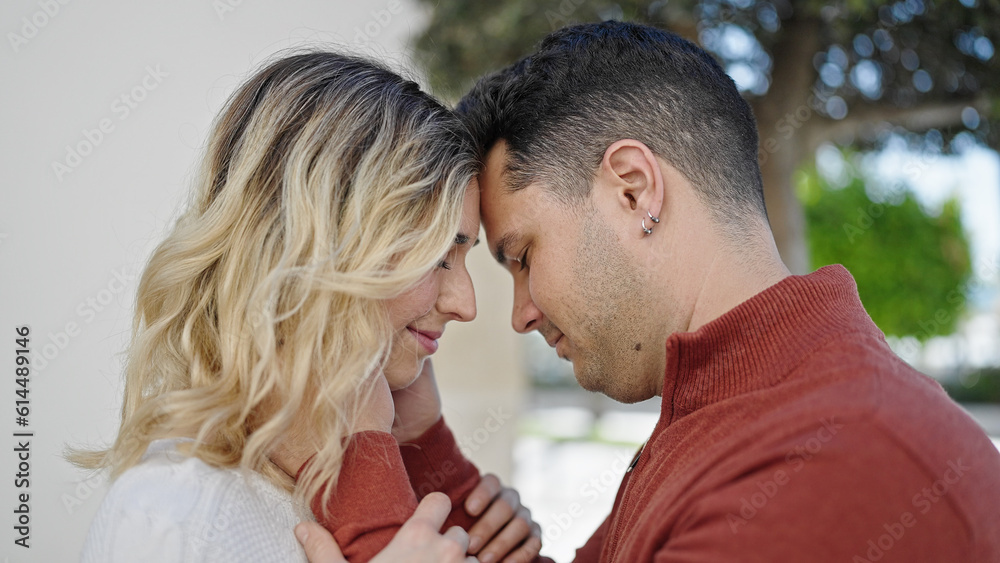 Man and woman couple smiling confident standing together at street Man and woman couple smiling confident standing together at street