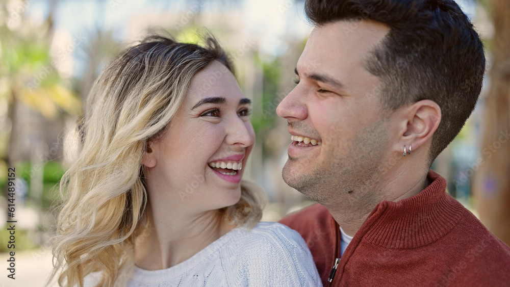 Man and woman couple smiling confident standing together at park Man and woman couple smiling confident standing together at park